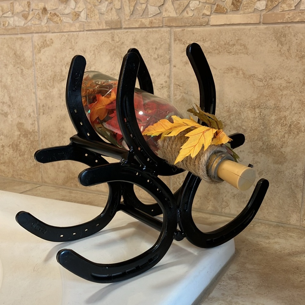 Handmade horseshoe wine bottle holder
